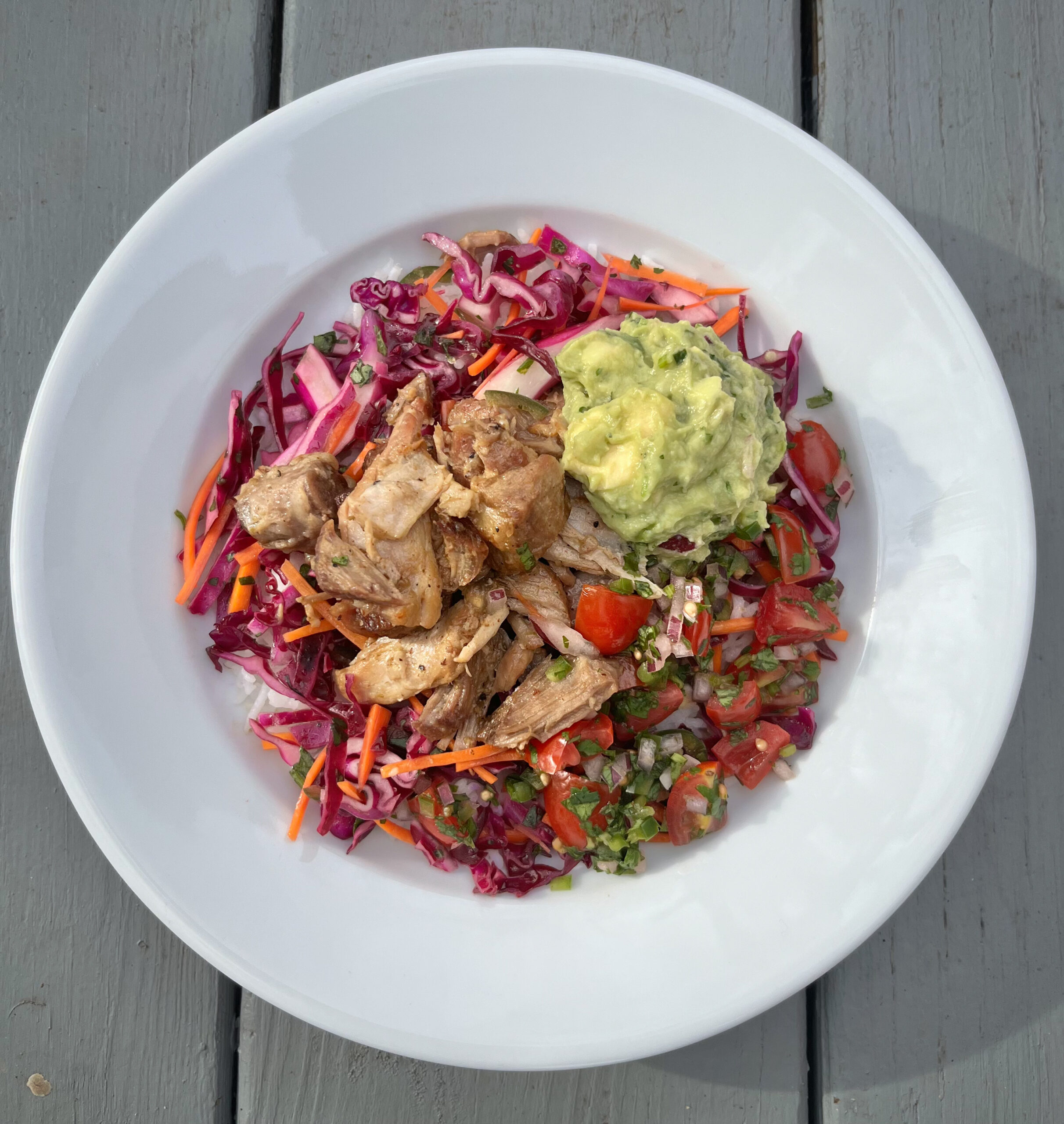Chicken Burrito Bowl Chicken Burrito Bowl with Spicy Citrus Slaw, Pico de Gallo, Guacamole, & Cilantro Cauliflower Rice